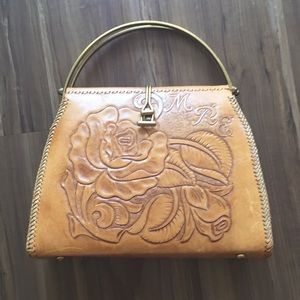 Unique vintage leather purse with metal handles